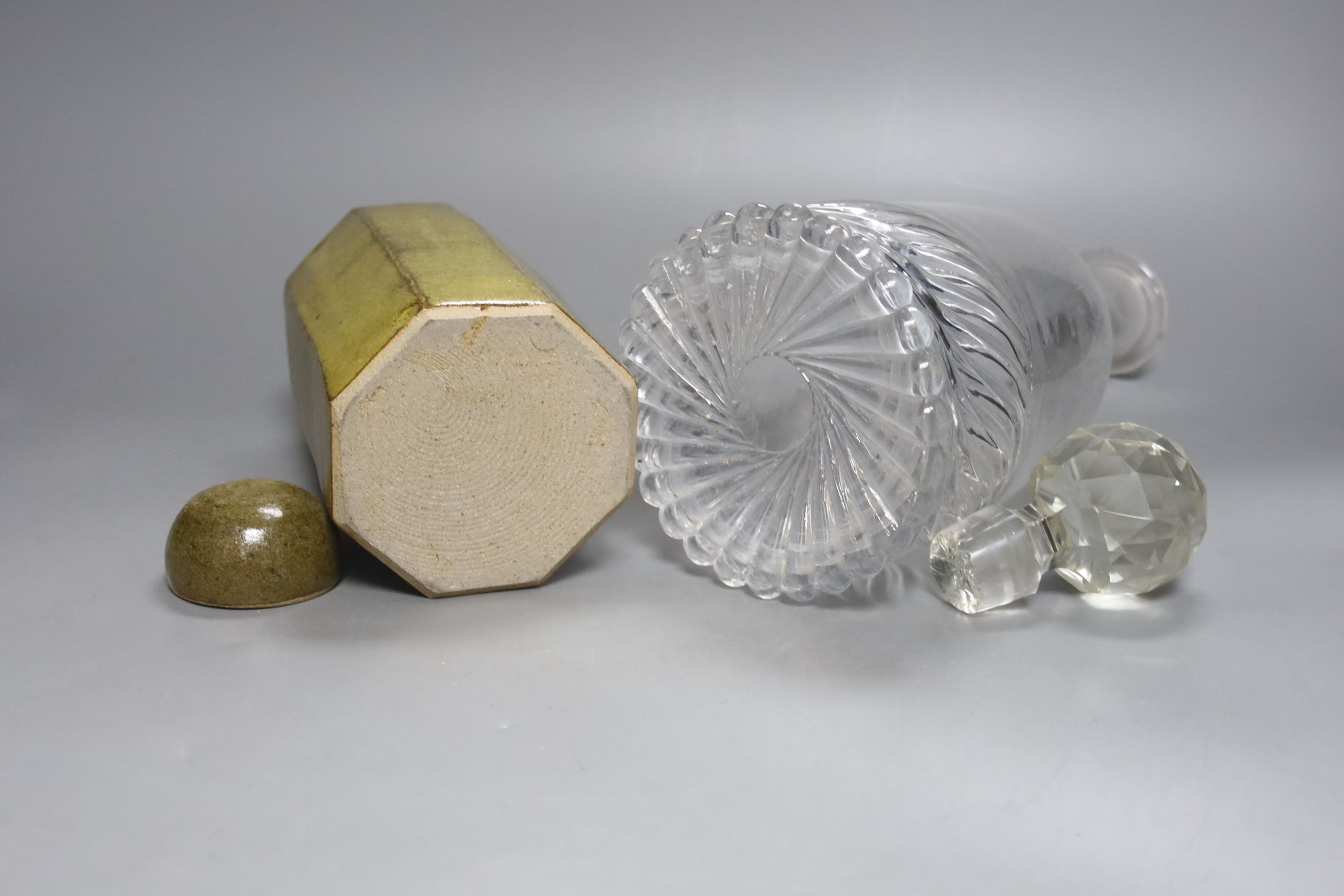 A St Ives style studio pottery jar and cover and a glass decanter and associated stopper 33cm